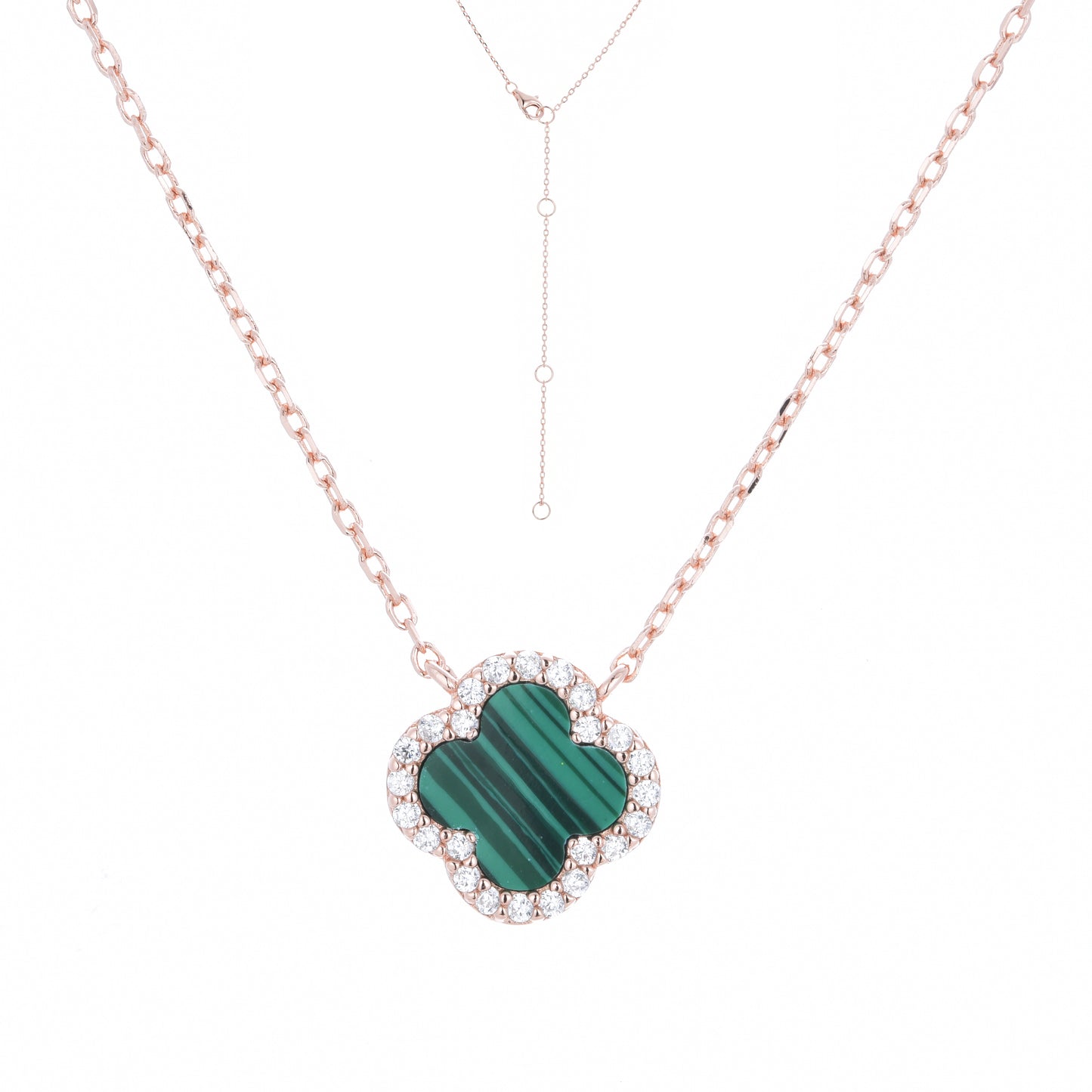 Rose gold malachite clover necklace with white cubic zirconia .