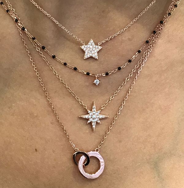Elegant rose gold plated silver necklace with black beads and central sparkling Cubic Zirconia.