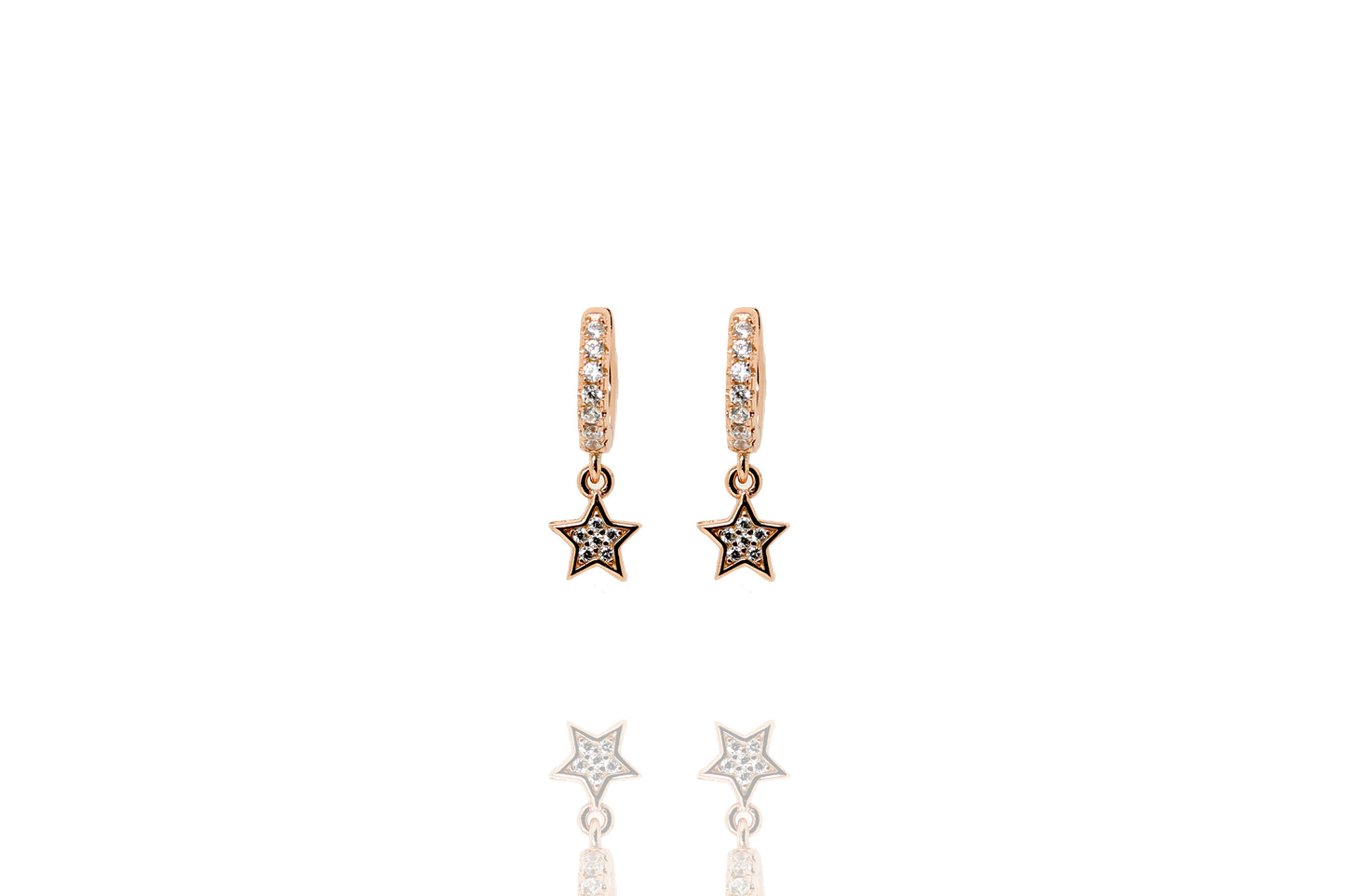 Rose gold-plated huggie earrings with star charms set with white cubic zirconia stones.