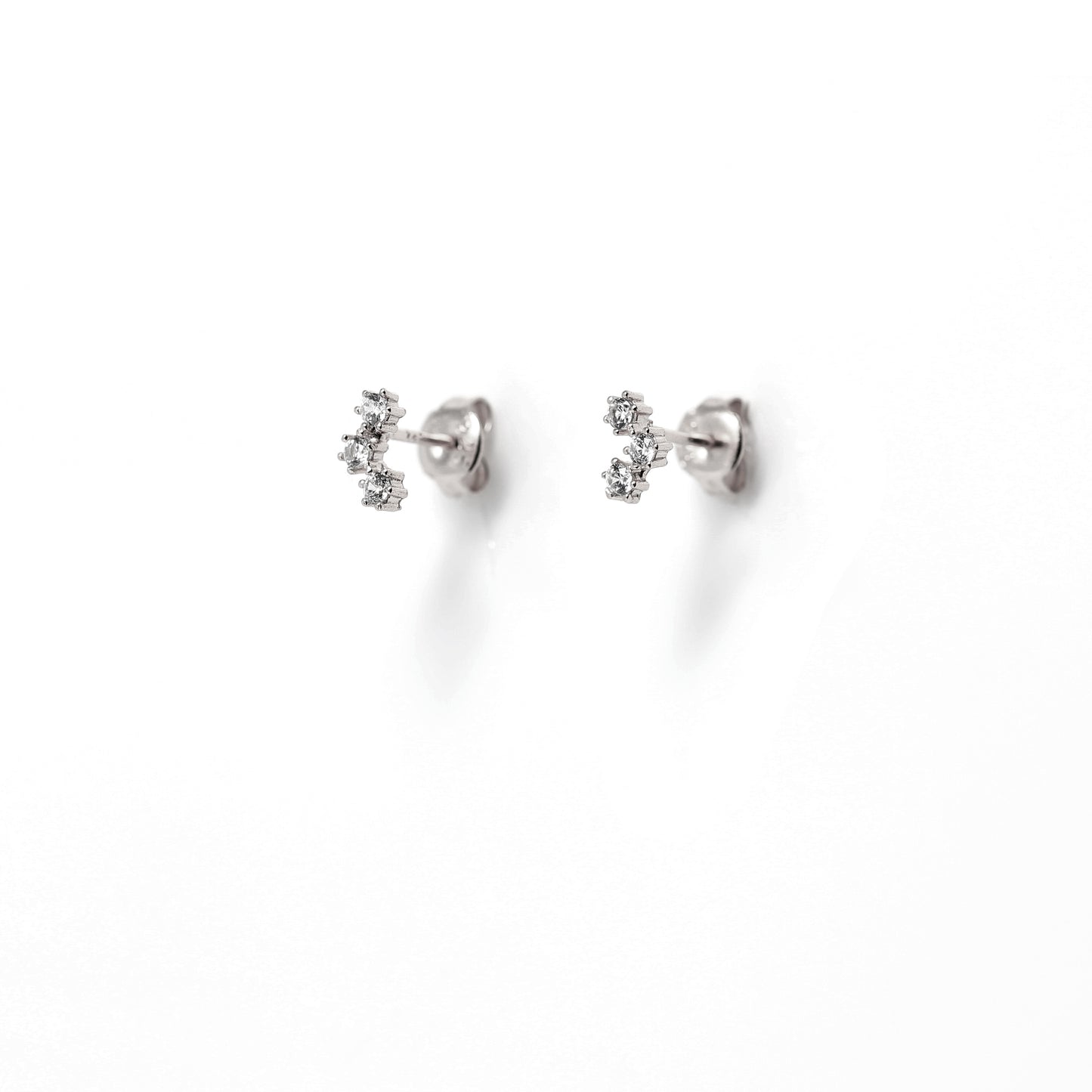 Sterling silver stud earrings with a 3 cubic zirconia cluster, displayed .