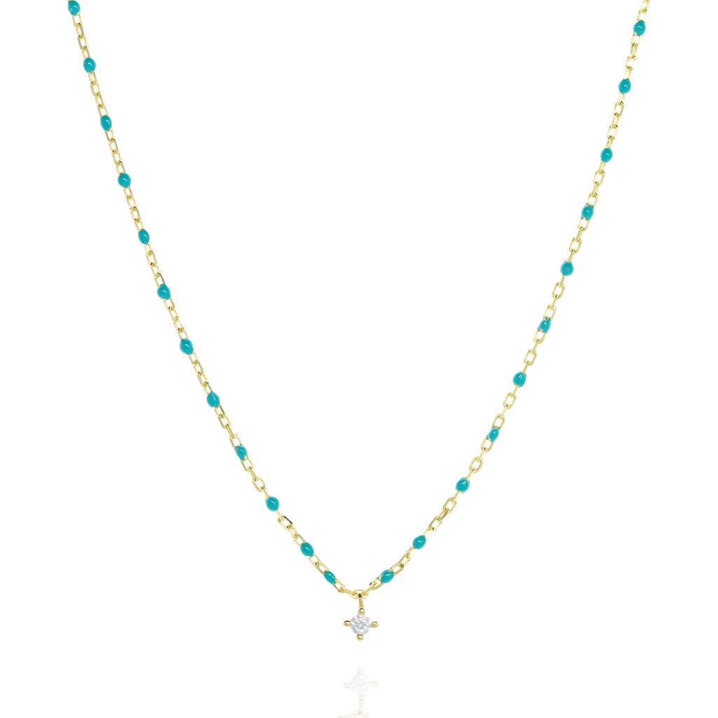 Gold-plated short chain and turquoise bead necklace with a central Cubic Zirconia stone.
