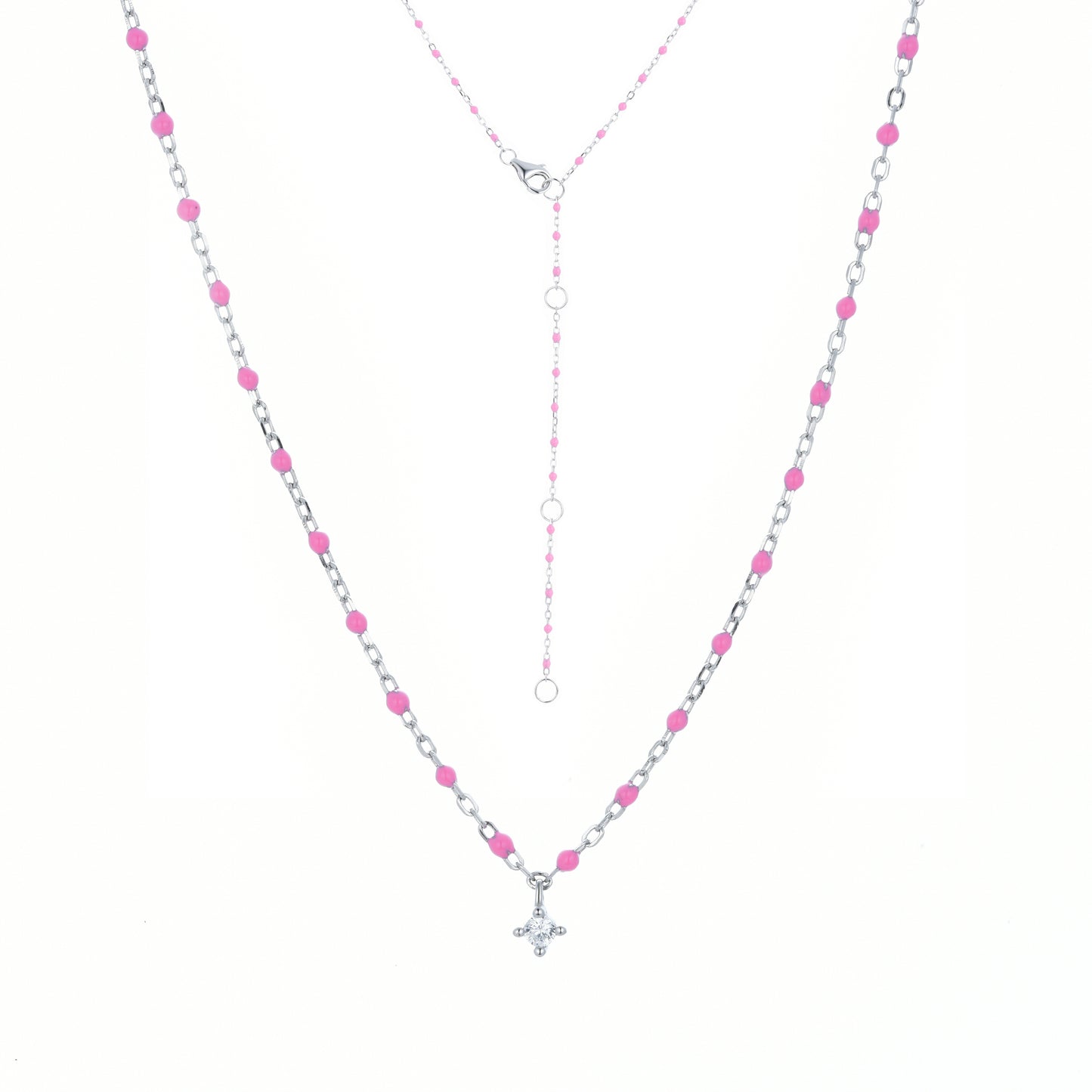 Sterling silver chain and bead necklace with fuchsia coloured beads and a hanging cubic zirconia pendant.