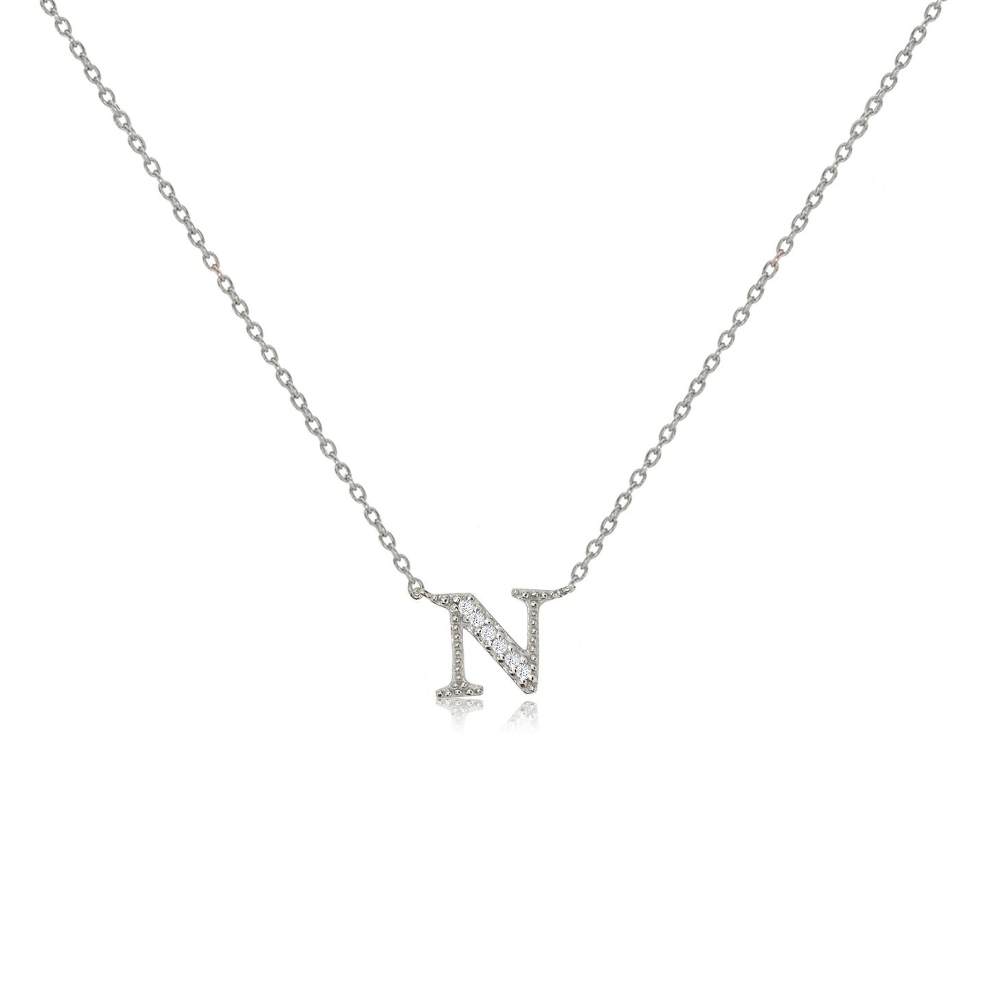Sterling silver initial necklace featuring an 'N' pendant decorated with cubic zirconia stones on an adjustable chain.