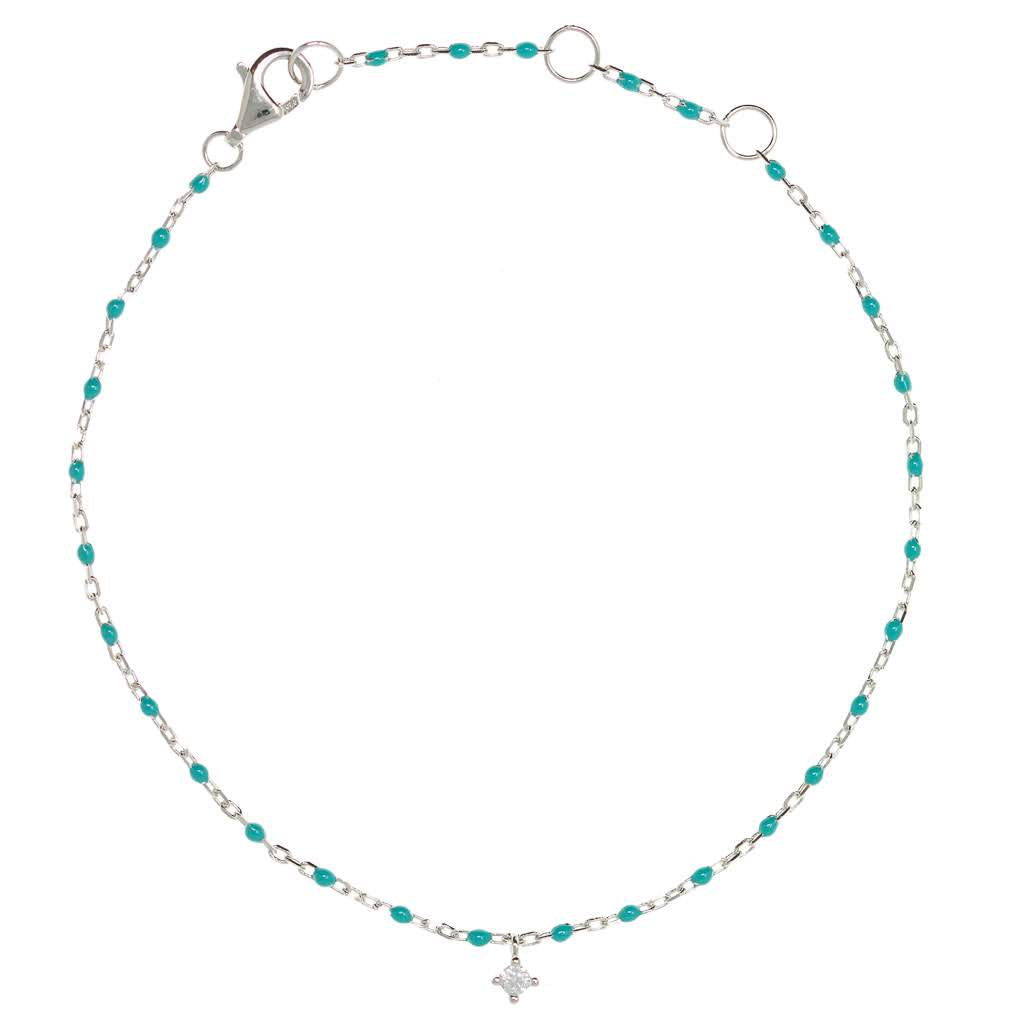
Sterling silver chain bracelet with turquoise beads and a hanging CZ charm in the centre.

