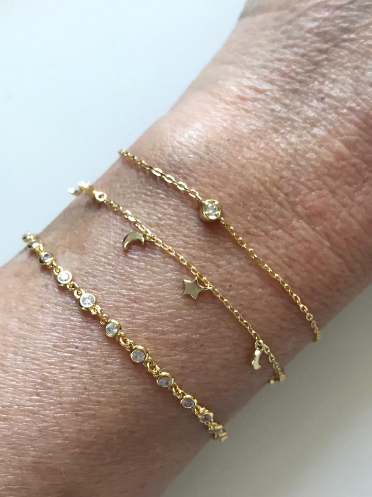 
Gold plated silver chain bracelet featuring a single cubic zirconia gemstone


