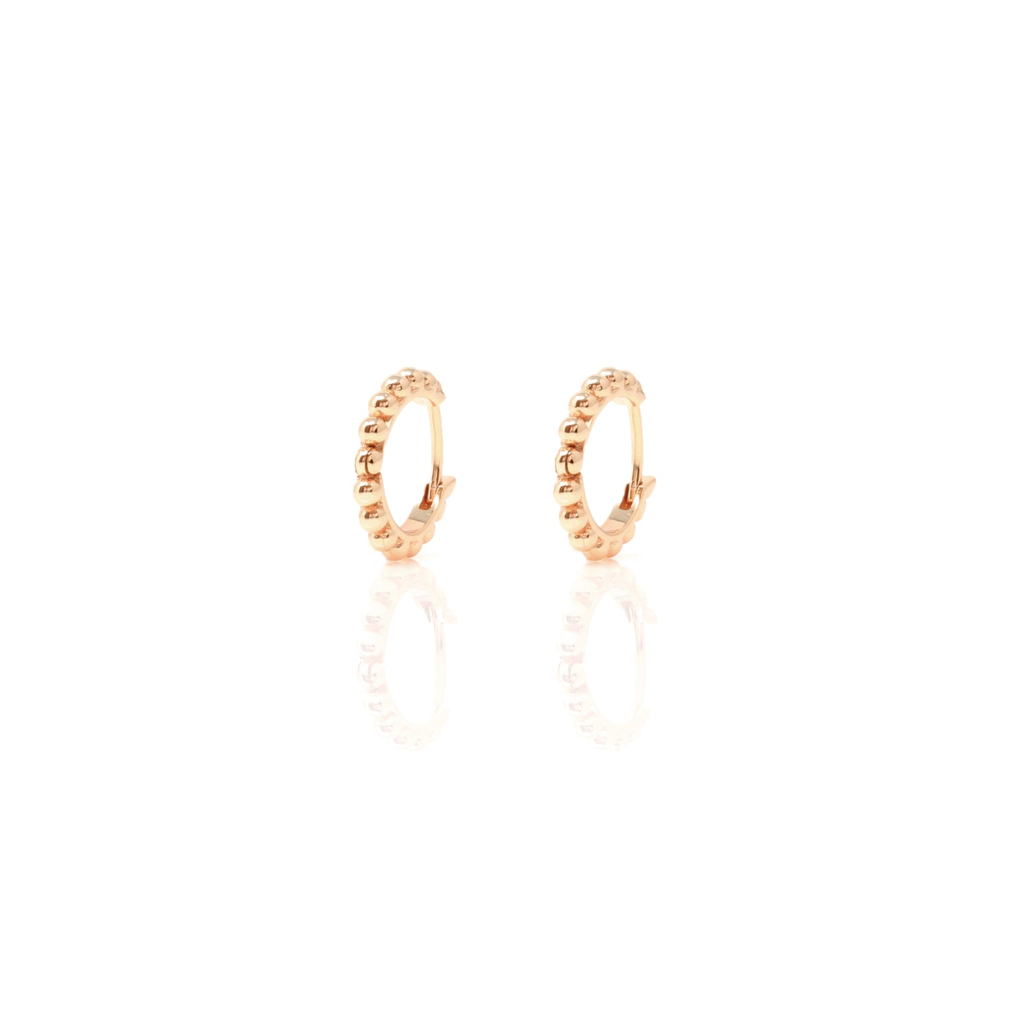 

Pair of rose gold plated huggie earrings with contoured hoop design  .

