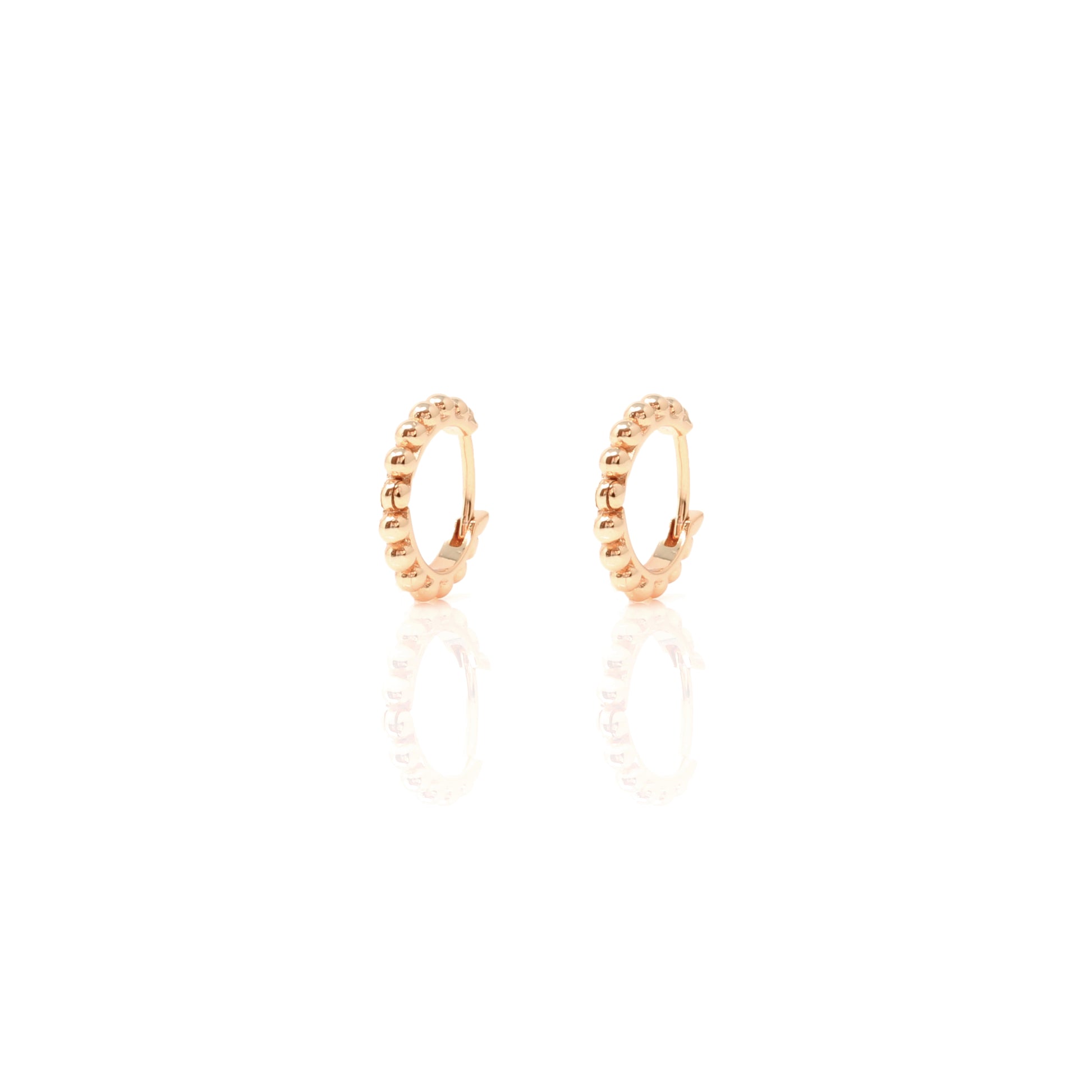 

Pair of rose gold plated huggie earrings with contoured hoop design  .


