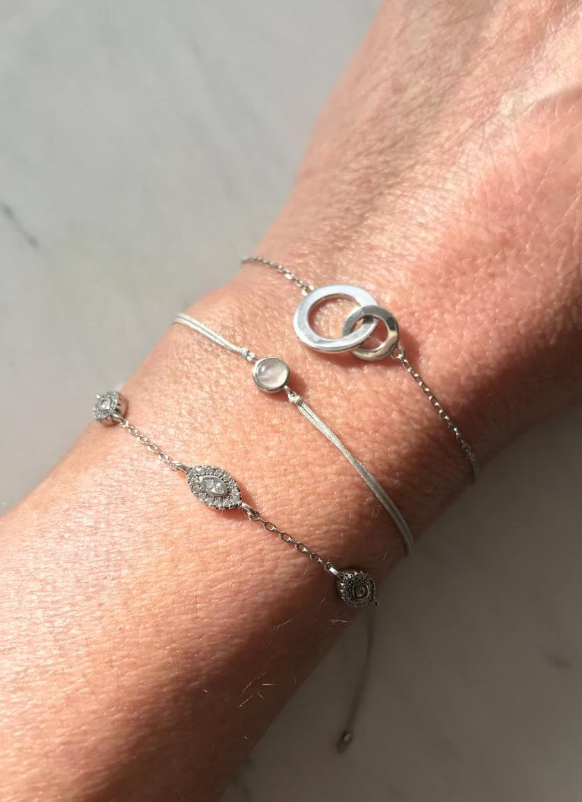 
Delicate adjustable string bracelet featuring a moonstone set in a sterling silver bezel.

