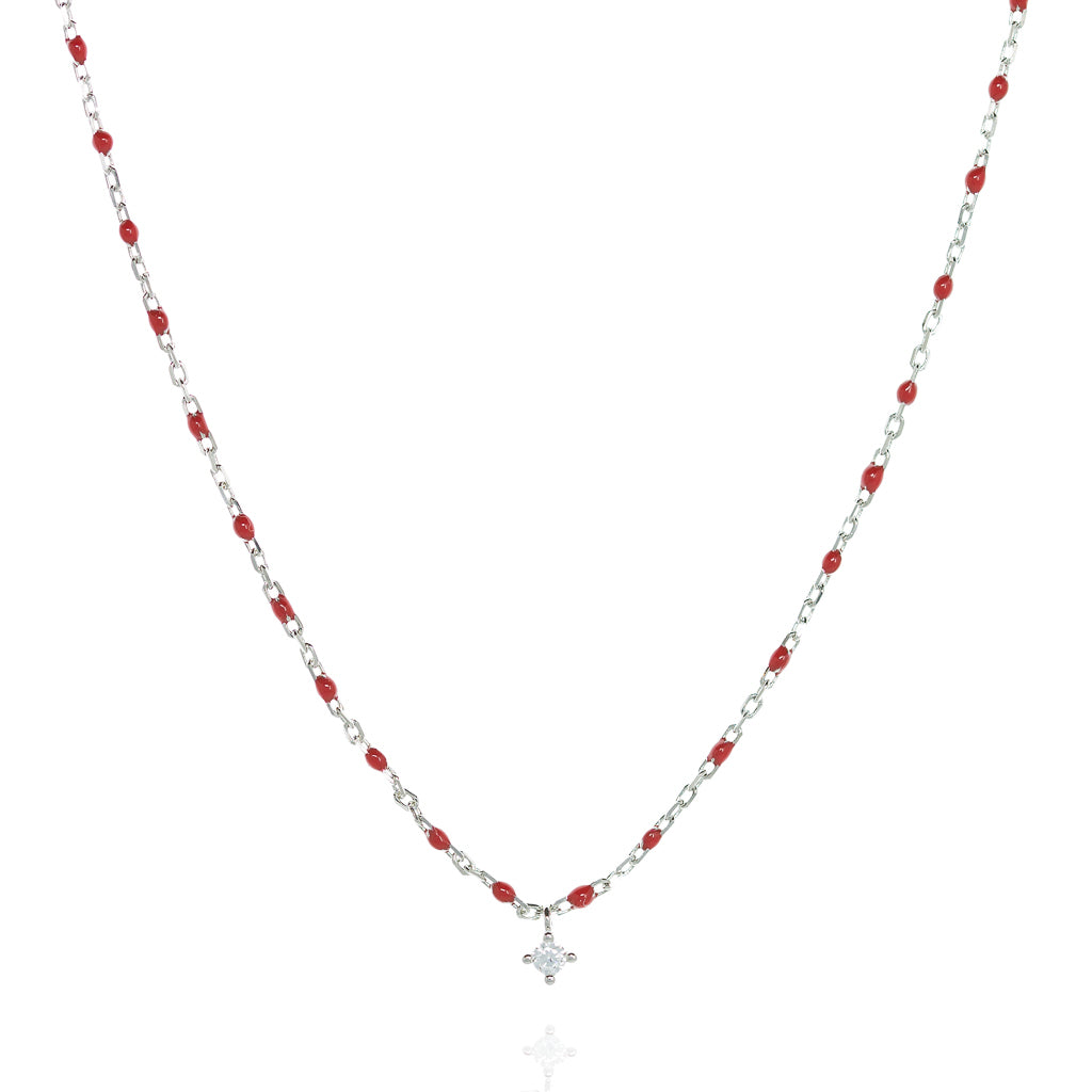 
Sterling silver short chain necklace with red beads and a central small Cubic Zirconia.

