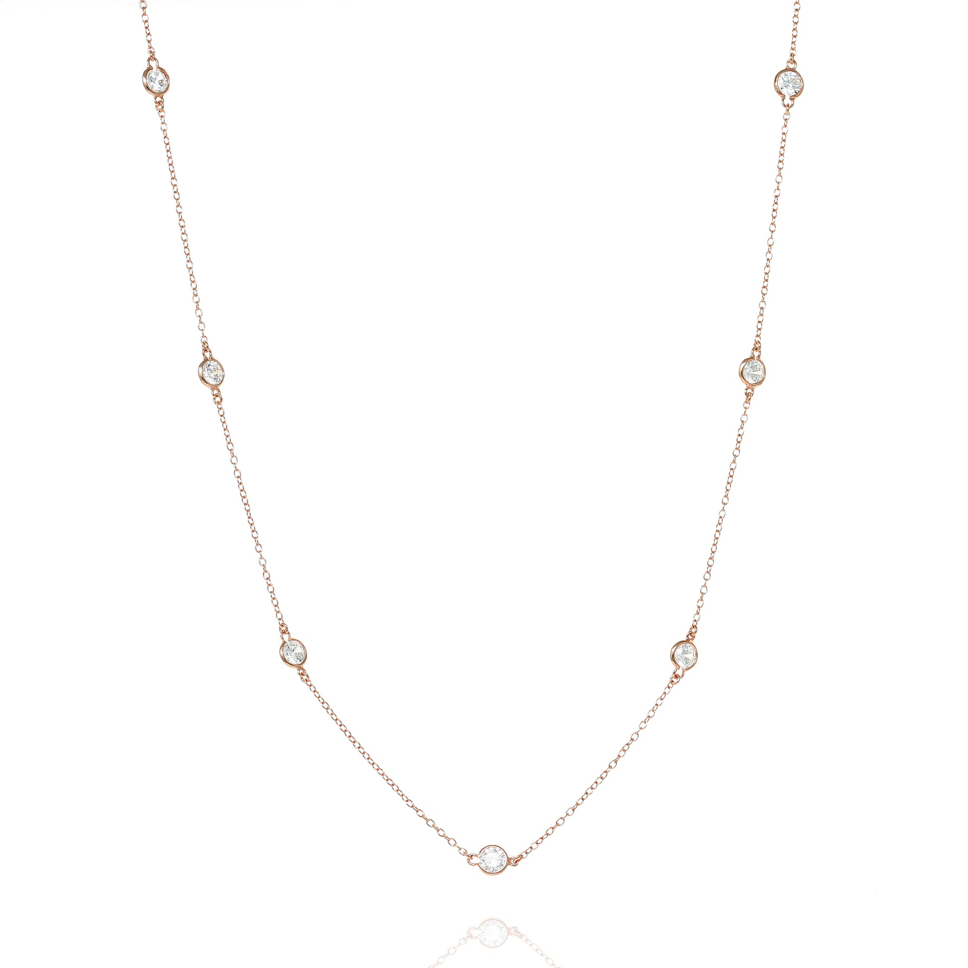
A stunning rose gold-plated necklace made of sterling silver with bezel-cut cubic zirconia, featuring a delicate chain design. 

