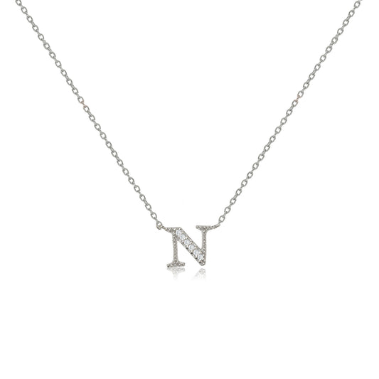
Sterling silver initial necklace featuring an 'N' pendant decorated with cubic zirconia stones on an adjustable chain.

