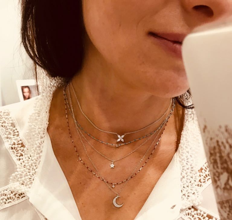 
Rose gold plated sterling silver short necklace with red beads and central Cubic Zirconia gem.

