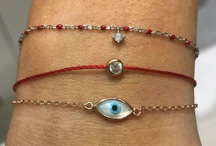 
Rose gold plated silver chain bracelet with red beads and hanging CZ charm

